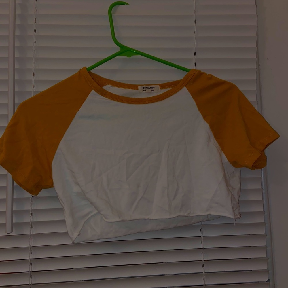 Golden yellow and white cropped T-shirt.